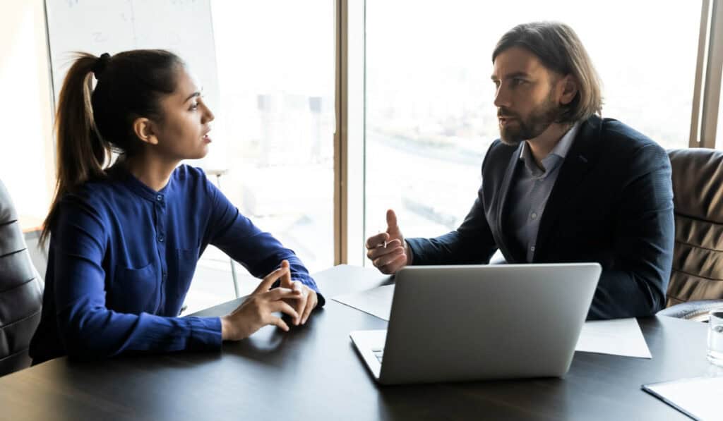 Boss and employee talking