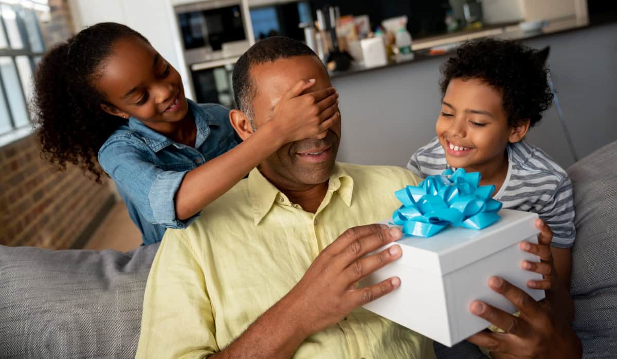 Kids giving father a gift